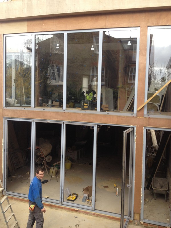 Aluminium bi-fold doors with two-storey glazing in Windsor