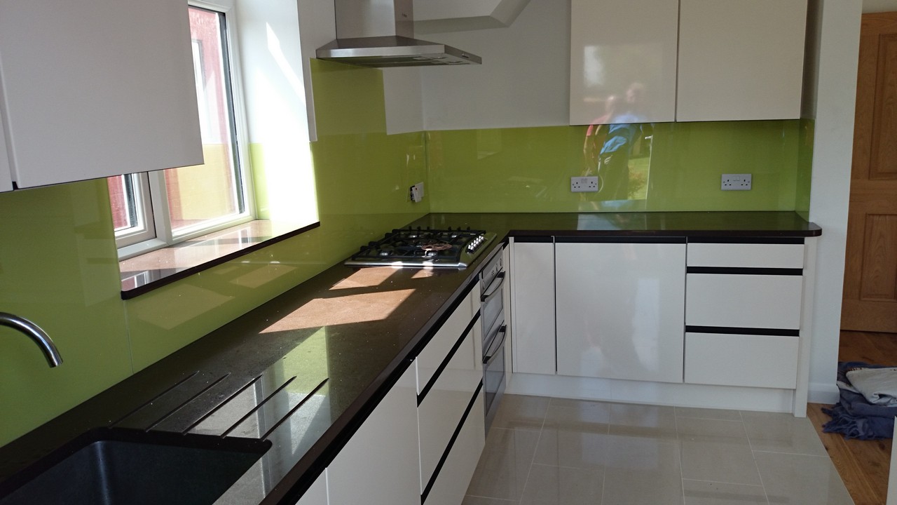 Lime green glass kitchen splashback installed by Windsor glaziers